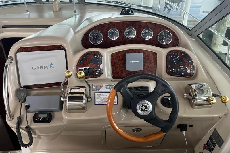 Chance Encounter Yacht Photos Pics 2004 Sea Ray 340 Sundancer helm with Garmin and Raymarine navigation systems.
