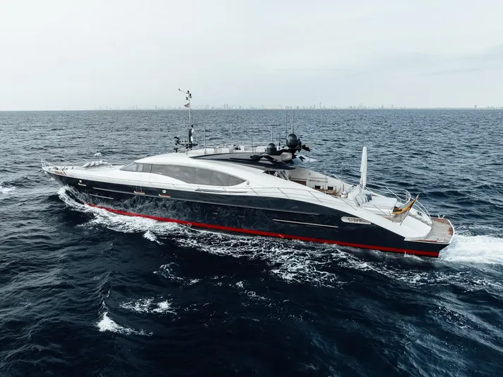 Burn Rate Yacht Photos Pics 2006 Palmer Johnson Express yacht cruising on open sea, sleek design, luxury vessel.