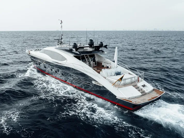 Burn Rate Yacht Photos Pics Luxury 2006 Palmer Johnson Express yacht cruising on open sea.