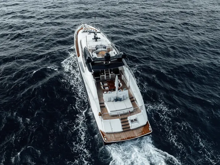 Burn Rate Yacht Photos Pics Luxury 2006 Palmer Johnson Express yacht cruising on open sea.