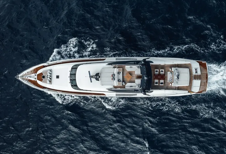 Burn Rate Yacht Photos Pics Top view of a 2006 Palmer Johnson Express yacht cruising on the ocean.