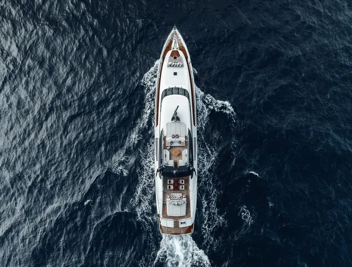 Burn Rate Yacht Photos Pics Aerial view of 2006 Palmer Johnson Express yacht cruising on open sea.