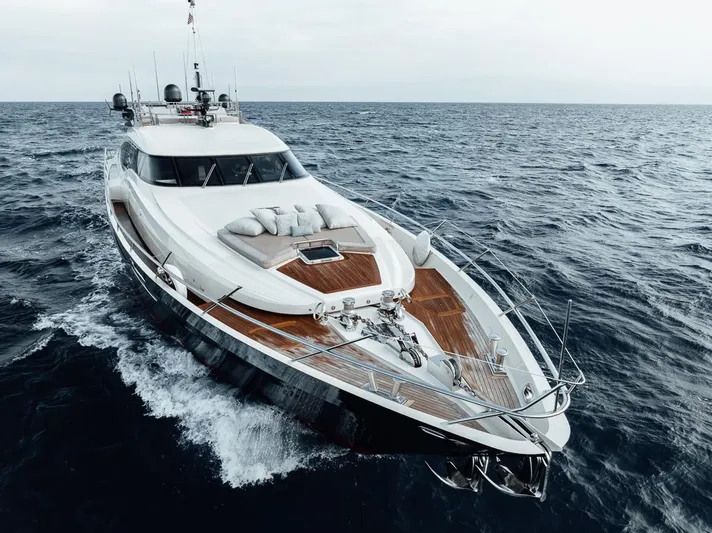 Burn Rate Yacht Photos Pics Luxury 2006 Palmer Johnson Express yacht cruising on open sea.