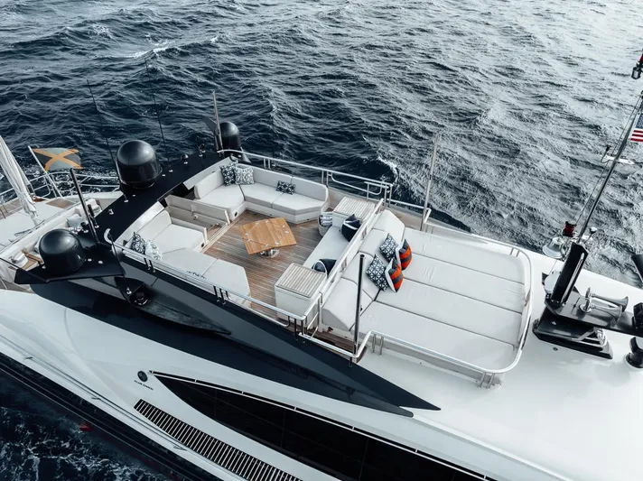 Burn Rate Yacht Photos Pics Luxurious 2006 Palmer Johnson Express yacht with spacious deck, cruising on open sea.