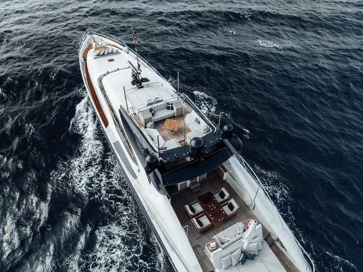 Burn Rate Yacht Photos Pics 2006 Palmer Johnson Express yacht cruising on open sea, aerial view.