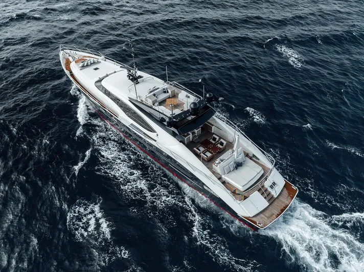 Burn Rate Yacht Photos Pics Palmer Johnson Express 2006 yacht cruising on open sea, aerial view.