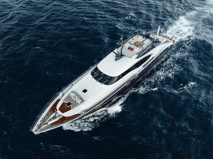 Burn Rate Yacht Photos Pics Aerial view of 2006 Palmer Johnson Express yacht cruising on open sea.