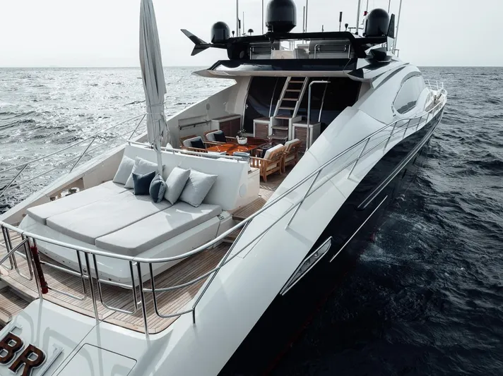 Burn Rate Yacht Photos Pics Luxurious 2006 Palmer Johnson Express yacht cruising on open sea, featuring elegant deck design.