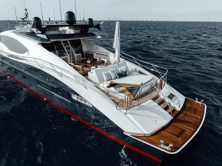 Burn Rate Yacht Photos Pics Luxurious 2006 Palmer Johnson Express yacht cruising on open sea.