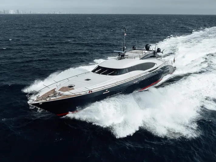 Burn Rate Yacht Photos Pics Luxury 2006 Palmer Johnson Express yacht cruising on open sea.