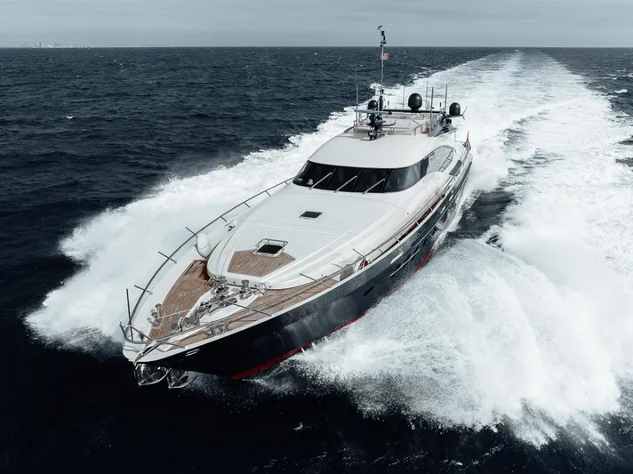 Burn Rate Yacht Photos Pics Luxury 2006 Palmer Johnson Express yacht cruising on open sea.