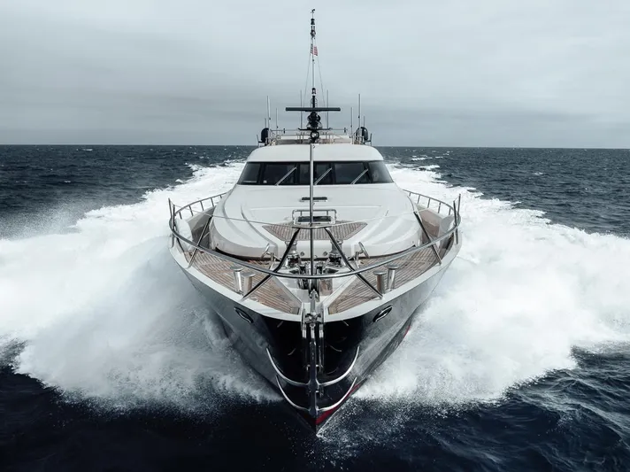 Burn Rate Yacht Photos Pics 2006 Palmer Johnson Express yacht cruising through ocean waves.