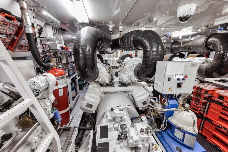Burn Rate Yacht Photos Pics Engine room of a 2006 Palmer Johnson Express yacht, featuring complex machinery and equipment.