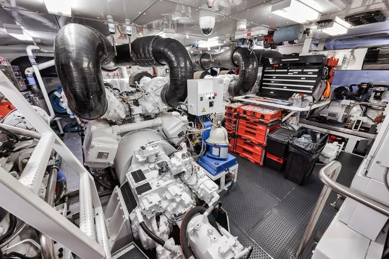 Burn Rate Yacht Photos Pics Engine room of a 2006 Palmer Johnson Express yacht, featuring advanced machinery and tools.