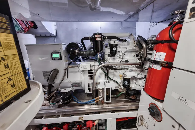 Burn Rate Yacht Photos Pics Engine room of a 2006 Palmer Johnson Express yacht, featuring machinery and safety equipment.