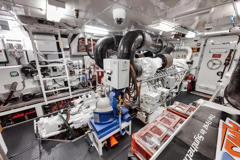 Burn Rate Yacht Photos Pics Engine room of a 2006 Palmer Johnson Express yacht, showcasing machinery and equipment.