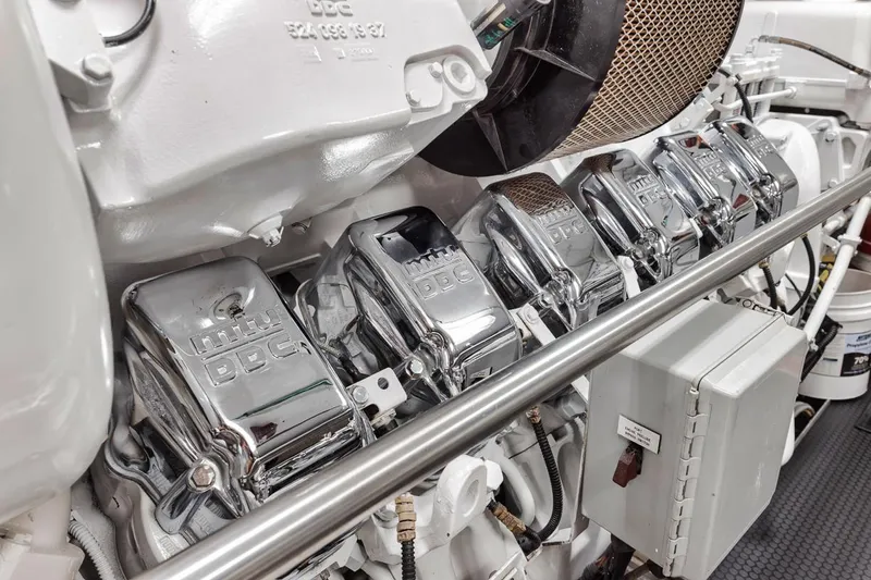 Burn Rate Yacht Photos Pics Engine components of a 2006 Palmer Johnson Express yacht, featuring chrome details and mechanical parts.