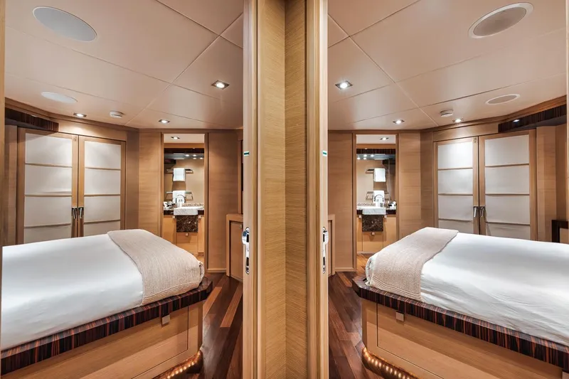 Burn Rate Yacht Photos Pics Luxurious 2006 Palmer Johnson Express yacht cabin with elegant wood finishes and modern amenities.