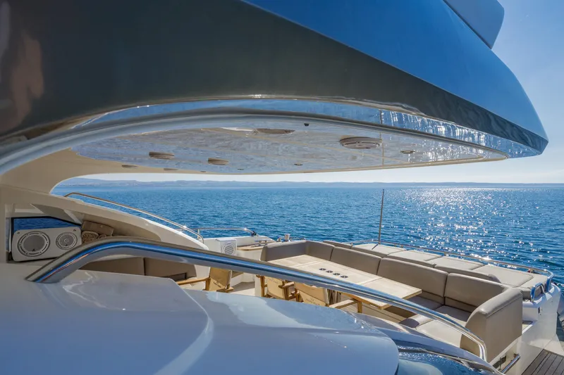 Black Sugar Yacht Photos Pics Luxurious 2010 Princess V78 yacht deck with ocean view and elegant seating area.