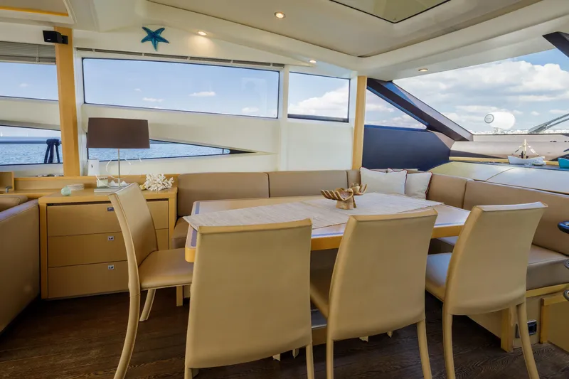 Black Sugar Yacht Photos Pics Luxurious interior of 2010 Princess V78 yacht with elegant dining area and sea view.