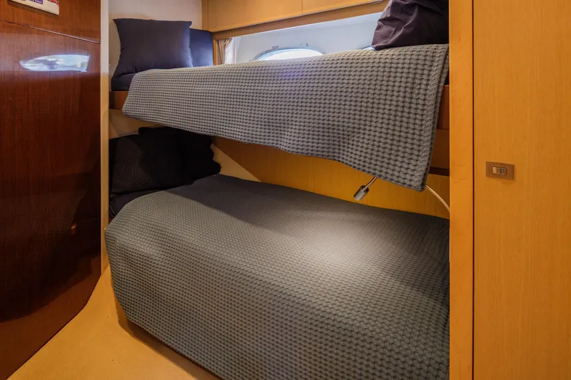 Black Sugar Yacht Photos Pics Bunk beds in 2010 Princess V78 yacht cabin with cozy bedding.