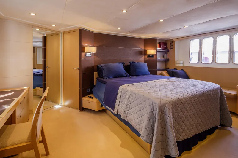 Black Sugar Yacht Photos Pics Luxurious bedroom interior on 2010 Princess V78 yacht with elegant furnishings and natural light.