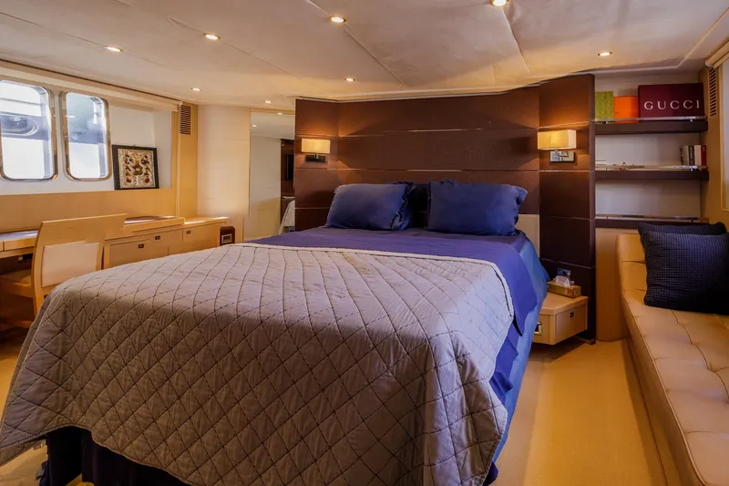 Black Sugar Yacht Photos Pics Luxurious 2010 Princess V78 yacht bedroom with elegant decor and comfortable bedding.