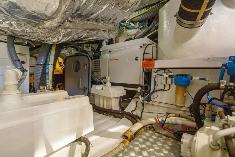 Black Sugar Yacht Photos Pics Engine room of 2010 Princess V78 yacht with machinery and piping.