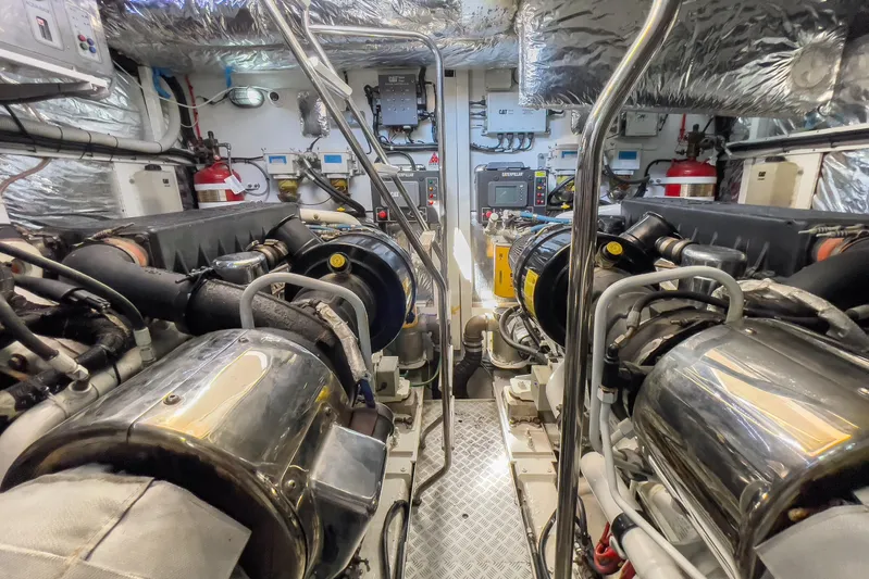 Black Sugar Yacht Photos Pics Engine room of a 2010 Princess V78 yacht, featuring dual engines and advanced equipment.