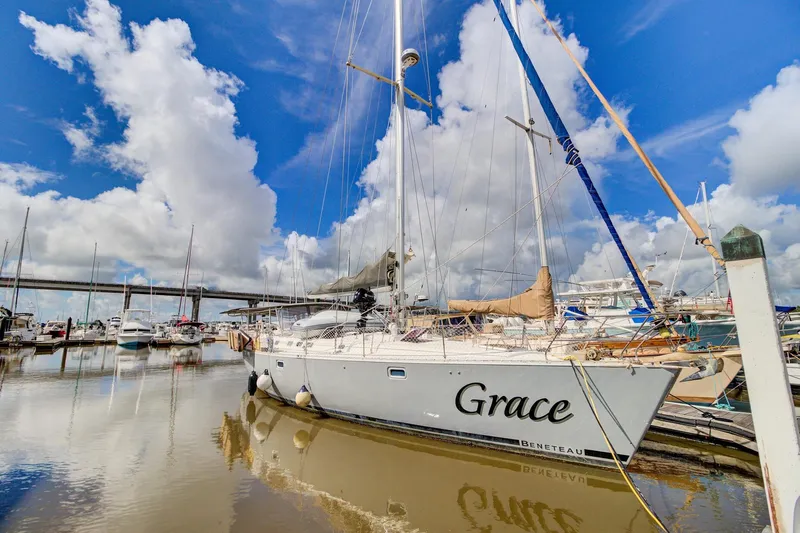 Grace Yacht Photos Pics Beneteau 510 sailboat named "Grace" docked in a marina, 1994 model.