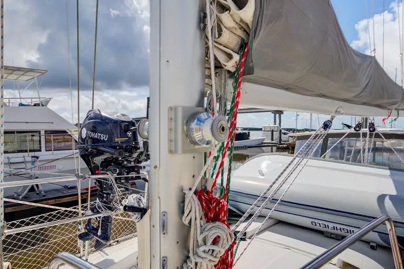 Grace Yacht Photos Pics 1994 Beneteau 510 sailboat with Tohatsu outboard motor, docked in a marina.