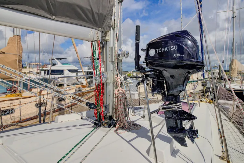 Grace Yacht Photos Pics Sailboat deck with Tohatsu outboard motor, Beneteau 510, 1994 model, docked at marina.