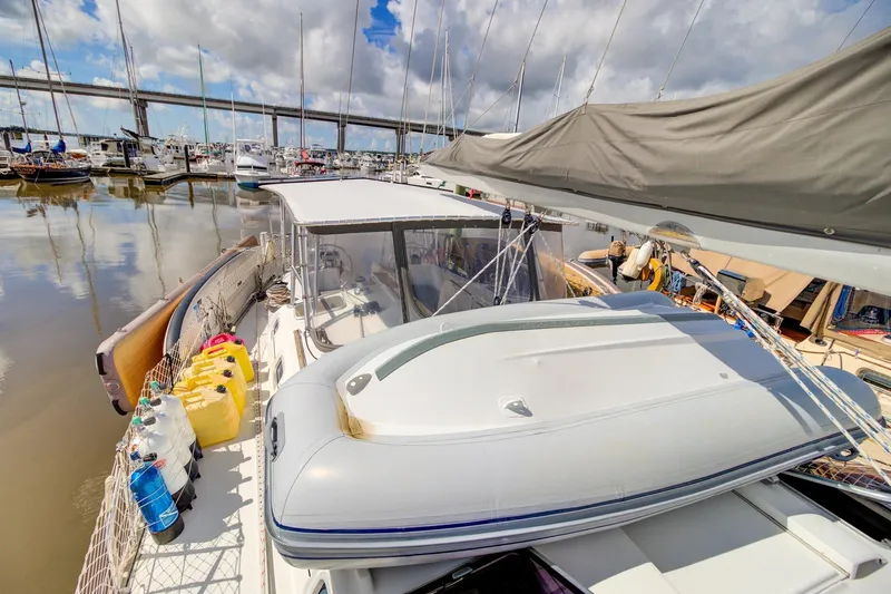 Grace Yacht Photos Pics 1994 Beneteau 510 sailboat docked at marina, featuring deck equipment and bridge view.