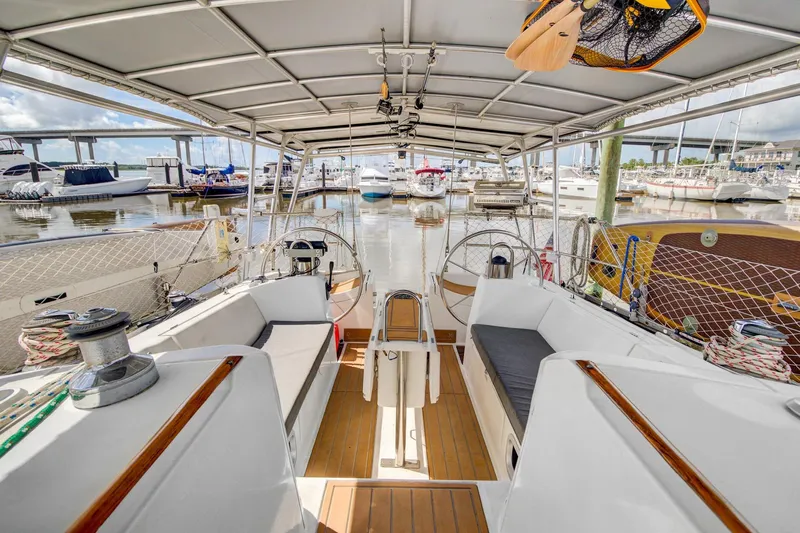 Grace Yacht Photos Pics Spacious cockpit of a 1994 Beneteau 510 yacht docked at a marina.