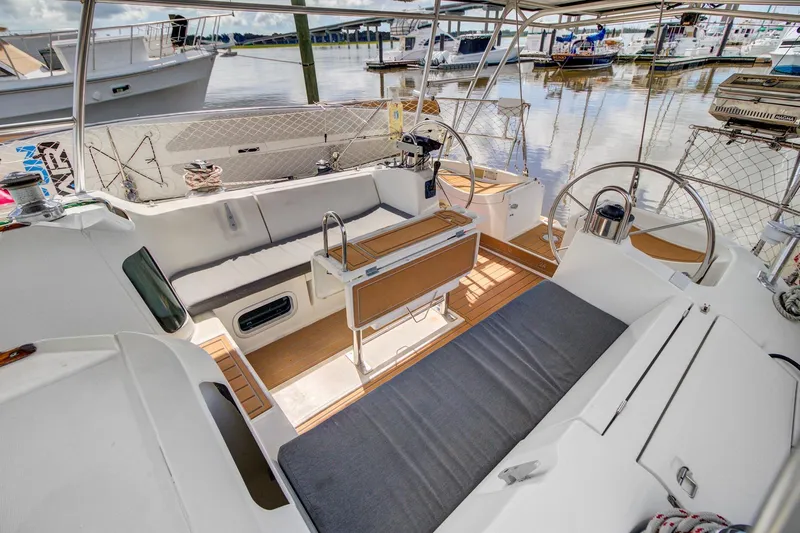 Grace Yacht Photos Pics Spacious cockpit of a 1994 Beneteau 510 sailboat with comfortable seating and steering wheel.