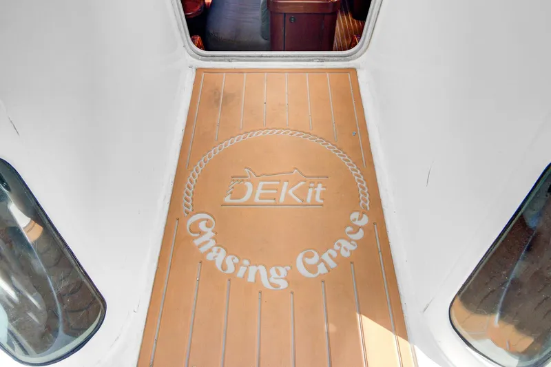 Grace Yacht Photos Pics Deck of 1994 Beneteau 510 sailboat with "Chasing Grace" and DEKit logo.