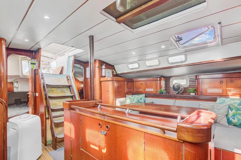 Grace Yacht Photos Pics Spacious interior of 1994 Beneteau 510 yacht with wooden finishes and skylights.