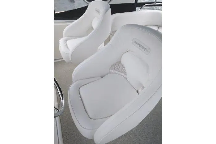  Yacht Photos Pics White cushioned seats on a 2005 Silverton 34 Convertible yacht interior.