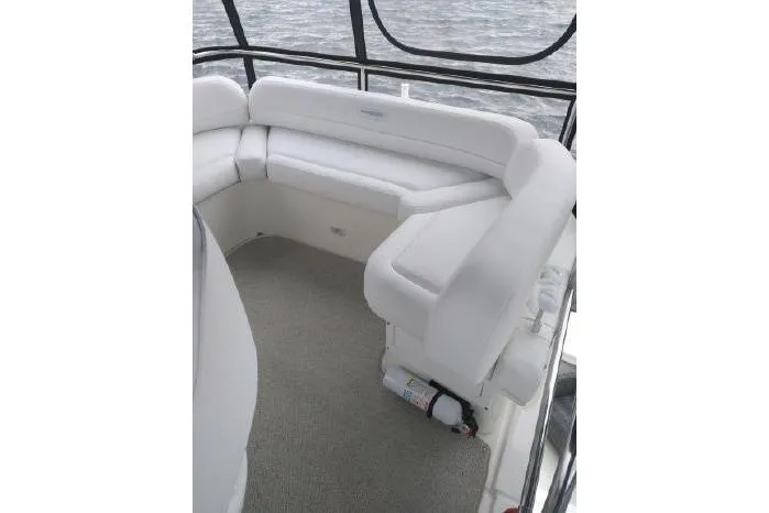  Yacht Photos Pics 2005 Silverton 34 Convertible boat interior with white seating and carpeted floor.