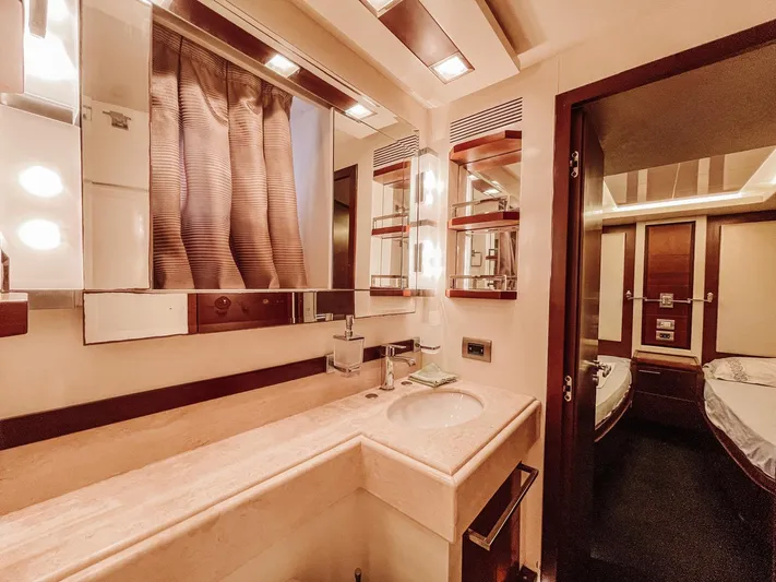  Yacht Photos Pics Luxurious bathroom interior of a 2009 Azimut 75 yacht, featuring elegant fixtures and lighting.