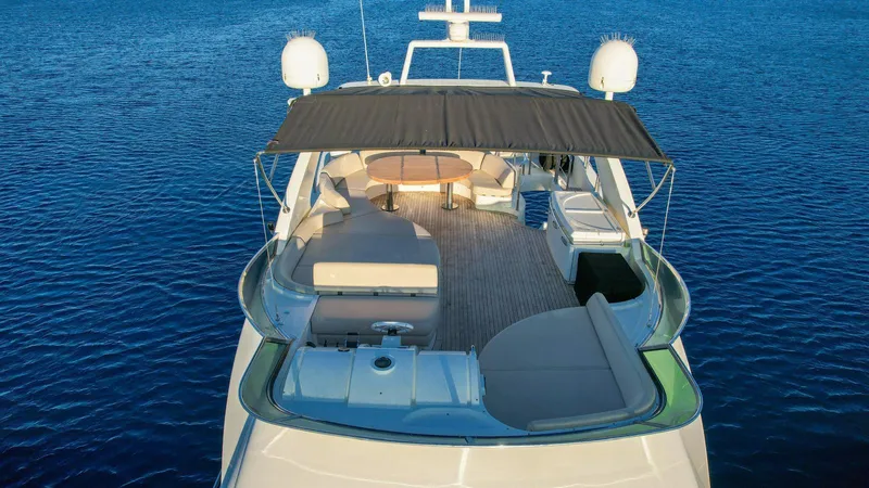  Yacht Photos Pics Luxury 2009 Azimut 75 yacht with spacious deck and seating, cruising on calm blue waters.