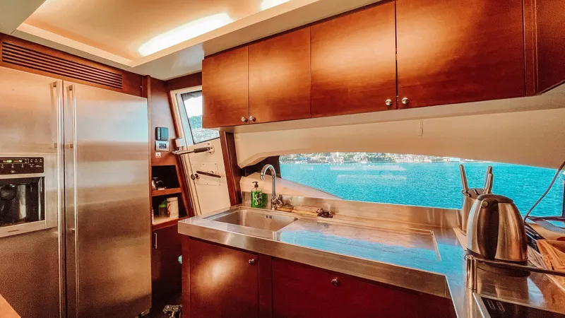  Yacht Photos Pics Luxurious kitchen interior of 2009 Azimut 75 yacht with ocean view.