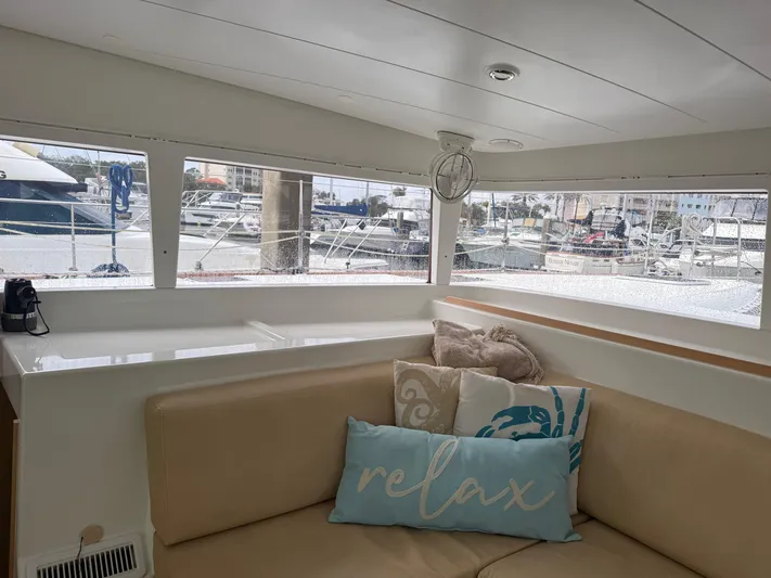 Feel The Moon Yacht Photos Pics Interior of 2010 Lagoon 400 catamaran with cozy seating and "relax" pillow.