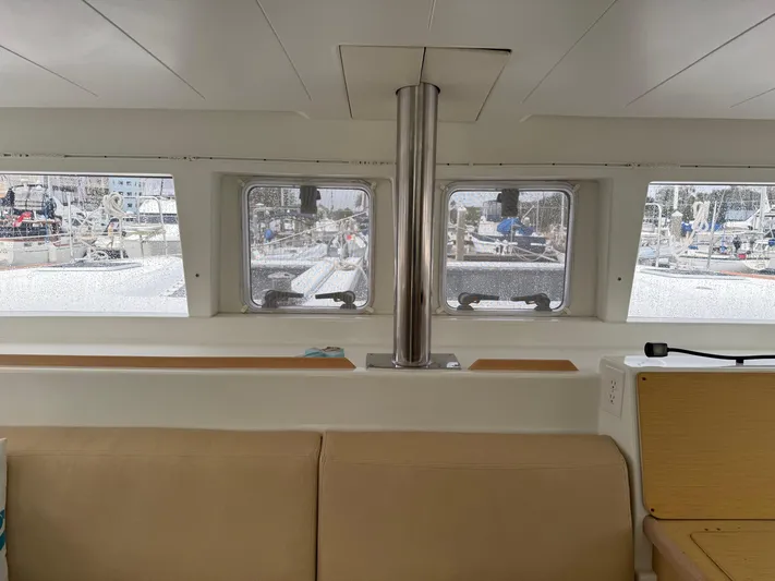 Feel The Moon Yacht Photos Pics Interior view of 2010 Lagoon 400 catamaran, showcasing windows and seating area.