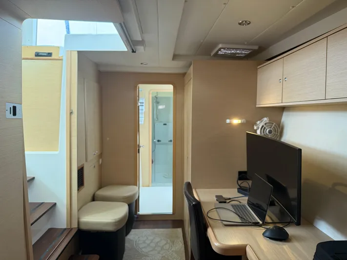 Feel The Moon Yacht Photos Pics Interior of 2010 Lagoon 400 yacht with workspace, seating, and modern amenities.