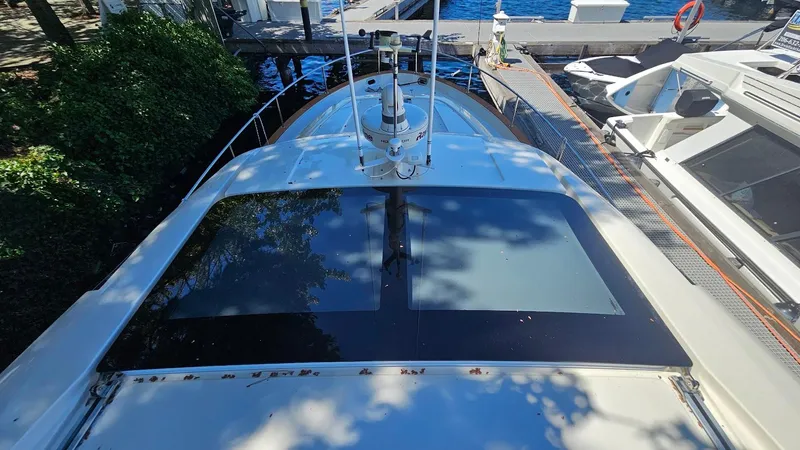 Bryanne Yacht Photos Pics 2014 Greenline 40 yacht docked at marina, top view with clear sky reflection.
