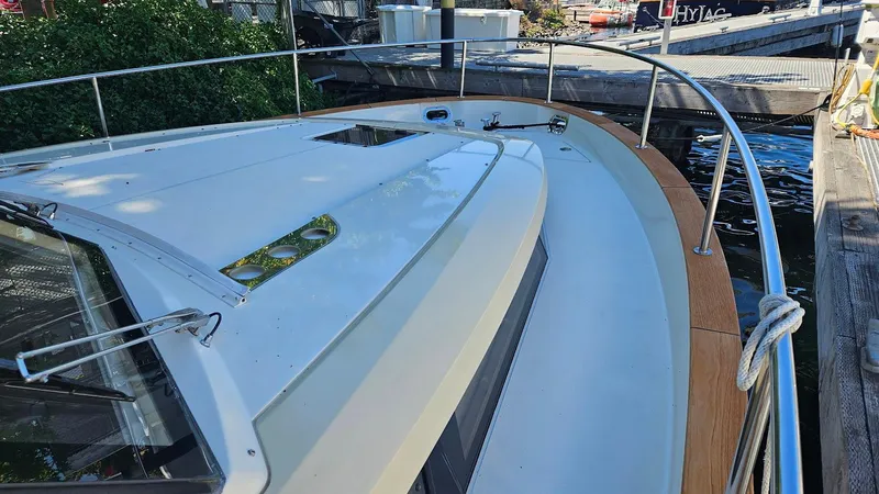 Bryanne Yacht Photos Pics 2014 Greenline 40 yacht docked, showcasing sleek deck design and railing.