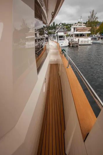 Bryanne Yacht Photos Pics Side deck of 2014 Greenline 40 yacht, featuring sleek design and wooden flooring.