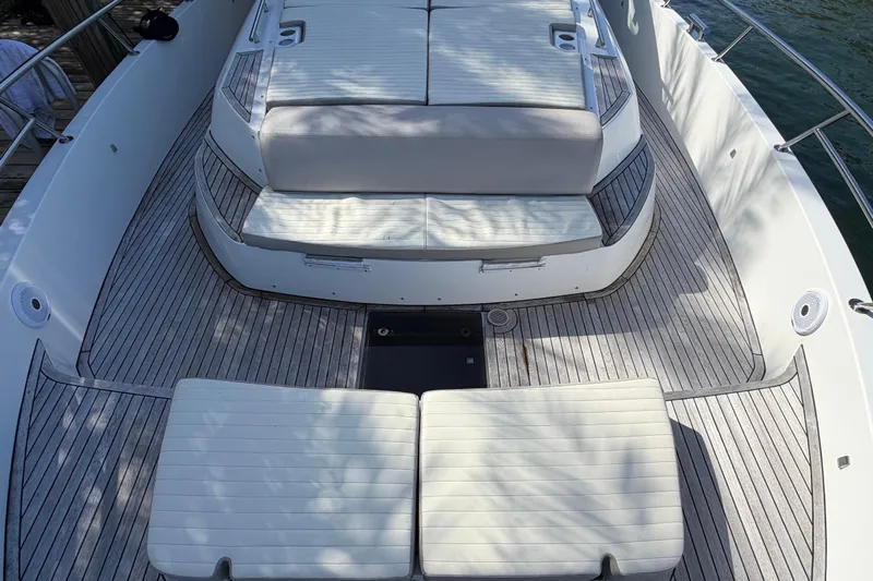 Veloce Yacht Photos Pics Luxurious 2017 Azimut Verve 40 yacht deck with cushioned seating and elegant wood finish.