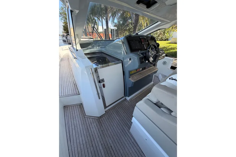 Veloce Yacht Photos Pics Interior view of 2017 Azimut Verve 40 yacht cockpit with modern controls and seating.